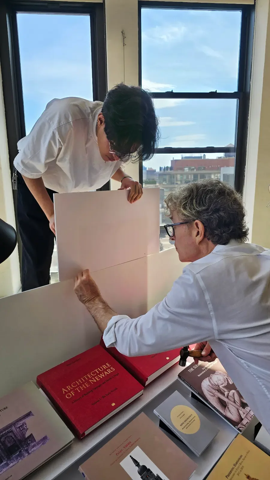 Visitors reviewing archival material at the Open Studio